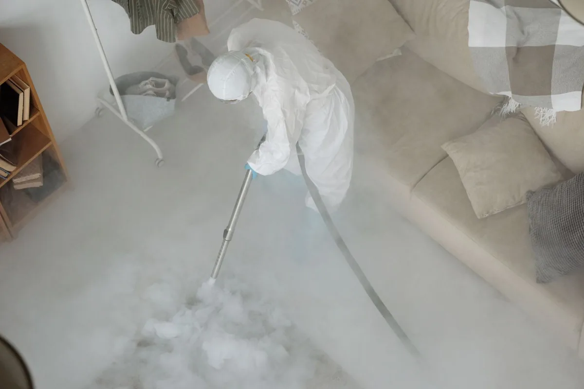 Biohazard cleanup technician in protective equipment, Bridgeton, NJ